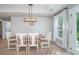 Dining room features a modern light fixture and plenty of natural light at 294 Field Loop Rd., Georgetown, SC 29440