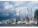 Scenic harbor view featuring numerous shrimp boats docked along the coastline under dramatic skies at 294 Field Loop Rd., Georgetown, SC 29440