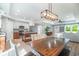 Open-concept living area with a kitchen featuring granite counters, an island, and stainless appliances at 294 Field Loop Rd., Georgetown, SC 29440
