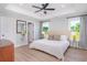 Light-filled main bedroom with tray ceiling and outdoor views at 294 Field Loop Rd., Georgetown, SC 29440