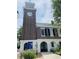 The historic Rice Museum, featuring a clock tower and architectural details, framed by greenery and clear sky at 294 Field Loop Rd., Georgetown, SC 29440
