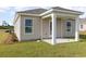 Back patio area with a covered porch, offering an outdoor space for relaxation or entertaining at 296 Clear Lake Dr., Conway, SC 29526