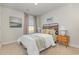 Cozy bedroom featuring a wooden headboard, neutral decor, and comfortable bedding, perfect for relaxation at 296 Clear Lake Dr., Conway, SC 29526