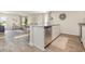 Open concept kitchen with stainless steel appliances, white cabinets, granite countertops, and view to the living area at 296 Clear Lake Dr., Conway, SC 29526