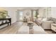 Bright living room features contemporary decor, stylish furniture, and wood-look flooring at 296 Clear Lake Dr., Conway, SC 29526