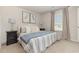 Bright main bedroom featuring a large window, carpet flooring, and neutral tones at 296 Clear Lake Dr., Conway, SC 29526