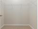 Empty walk-in closet with carpet flooring and adjustable wire shelving for storage at 296 Clear Lake Dr., Conway, SC 29526