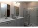 Modern bathroom featuring a double sink vanity, and a glass-enclosed shower stall at 304 Clear Lake Dr., Conway, SC 29526