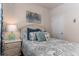 Comfortable bedroom with accent wall art, stylish bedding, and a matching side table at 304 Clear Lake Dr., Conway, SC 29526