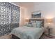 Cozy bedroom showcasing a comfortable bed, patterned drapes, and stylish lamps at 304 Clear Lake Dr., Conway, SC 29526