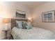Well-lit bedroom featuring comfortable bed with decorative pillows and coordinated wall art at 304 Clear Lake Dr., Conway, SC 29526