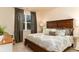 Comfortable bedroom with a large bed, patterned bedding, and natural light from the window at 304 Clear Lake Dr., Conway, SC 29526