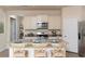 Stylish eat-in kitchen with island, granite countertops, stainless steel appliances, and neutral cabinets at 304 Clear Lake Dr., Conway, SC 29526