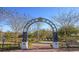 Charming Riverwalk entrance with landscaped surroundings and a clear blue sky at 304 Clear Lake Dr., Conway, SC 29526
