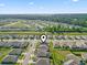 Aerial view of a residential neighborhood and the home, near a wooded area with a waterway and distant skyline at 3056 Skylar Dr., Myrtle Beach, SC 29577