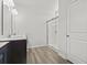 Well-lit bathroom featuring double sinks, modern fixtures, tile flooring, and a glass-enclosed shower at 3056 Skylar Dr., Myrtle Beach, SC 29577