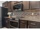 Close-up of kitchen showcasing granite countertops, stainless steel range, and tile backsplash at 3056 Skylar Dr., Myrtle Beach, SC 29577