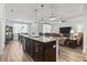 Open concept kitchen with a large island and seamless flow to the dining and living areas at 3056 Skylar Dr., Myrtle Beach, SC 29577