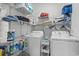 Functional laundry area with storage shelves and modern washer and dryer units at 3056 Skylar Dr., Myrtle Beach, SC 29577