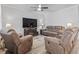 Inviting living room featuring comfortable seating, a ceiling fan, and a fireplace with TV at 3056 Skylar Dr., Myrtle Beach, SC 29577