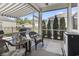 Relaxing screened-in porch features comfortable wicker seating and an adjustable awning at 3056 Skylar Dr., Myrtle Beach, SC 29577