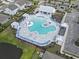 Aerial view of community pool with beach entry, sun loungers, and ample seating at 3056 Skylar Dr., Myrtle Beach, SC 29577