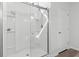 Modern walk-in shower featuring glass doors, white tile, and chrome fixtures at 3056 Skylar Dr., Myrtle Beach, SC 29577