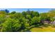 Lush backyard with mature trees and manicured landscaping at 311 71St Ave. N # 5A, Myrtle Beach, SC 29572