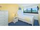 Cozy bedroom features a single bed, white furniture and large window with blinds, creating a relaxing and bright space at 311 71St Ave. N # 5A, Myrtle Beach, SC 29572