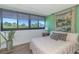 Serene bedroom with hardwood floors, a large window and neutral tones, creating a peaceful and relaxing retreat at 311 71St Ave. N # 5A, Myrtle Beach, SC 29572