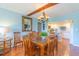 Spacious dining area with an elegant chandelier and access to the kitchen with tile flooring at 311 71St Ave. N # 5A, Myrtle Beach, SC 29572