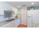 Well-lit kitchen featuring white cabinets, stainless steel appliances, granite countertops and tiled backsplash at 311 71St Ave. N # 5A, Myrtle Beach, SC 29572