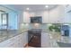 Modern kitchen with white cabinets, granite countertops, stainless steel appliances and open to the dining room at 311 71St Ave. N # 5A, Myrtle Beach, SC 29572