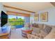 Beautiful and well-decorated living room with comfortable furniture, opening to a large outdoor balcony at 311 71St Ave. N # 5A, Myrtle Beach, SC 29572