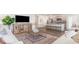 Open living room boasts modern decor, stylish furniture, and an open layout leading to the kitchen at 312 Clear Lake Dr., Conway, SC 29526