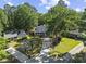An aerial view showcases this charming single-Gathering home surrounded by mature trees and green lawns at 314 Trace Run, Myrtle Beach, SC 29588