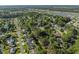 Expansive aerial view of a residential neighborhood, lush with trees and homes near ponds and a highway at 314 Trace Run, Myrtle Beach, SC 29588