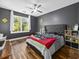 This bedroom features hard wood floors, a ceiling fan, and a window with a view at 314 Trace Run, Myrtle Beach, SC 29588