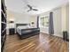 Spacious bedroom featuring hardwood floors, ceiling fan, and window views at 314 Trace Run, Myrtle Beach, SC 29588