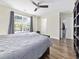 Primary bedroom features hardwood floors, ceiling fan, and large window at 314 Trace Run, Myrtle Beach, SC 29588