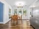 Dining area with table, chairs, modern light fixture and view to the backyard at 314 Trace Run, Myrtle Beach, SC 29588