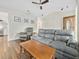 Warm and inviting living room with hardwood floors and comfortable leather furniture at 314 Trace Run, Myrtle Beach, SC 29588