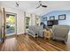 Bright living room with hardwood floors, vaulted ceiling, a ceiling fan, and a comfortable seating arrangement at 314 Trace Run, Myrtle Beach, SC 29588