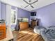 Cozy living room with a large window letting in natural light, hardwood flooring, bean bag chairs and a ceiling fan at 314 Trace Run, Myrtle Beach, SC 29588
