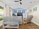 Cozy living room with hardwood floors, a comfortable sofa, and a wall-mounted television at 314 Trace Run, Myrtle Beach, SC 29588