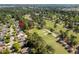 Residential community aerial view with adjacent golf course and mature tree coverage at 3157 Hermitage Dr., Little River, SC 29566