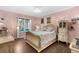 Cozy bedroom featuring hardwood floors, natural light, and vintage decor at 3157 Hermitage Dr., Little River, SC 29566