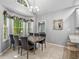 Dining room featuring a large window and a chandelier at 3157 Hermitage Dr., Little River, SC 29566