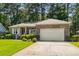 Charming brick home with well-manicured lawn and two-car garage in a desirable neighborhood at 3157 Hermitage Dr., Little River, SC 29566