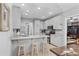 Well-lit kitchen featuring granite countertops, stainless steel appliances, and a breakfast bar with stools at 3157 Hermitage Dr., Little River, SC 29566